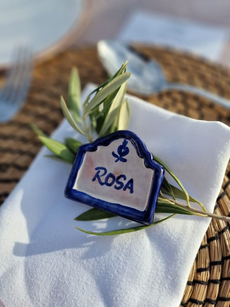 Hand-painted ceramic tile place card wedding favor with olive branch