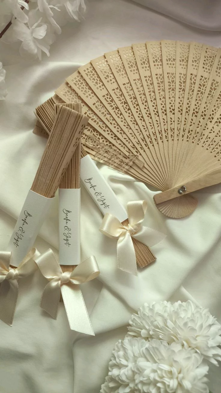 Personalised wooden lace fan wedding favors with ribbon and calligraphy tags