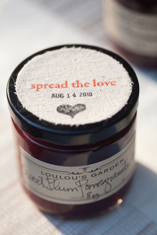 Homemade jam jar wedding favor with Spread the Love fabric lid label
