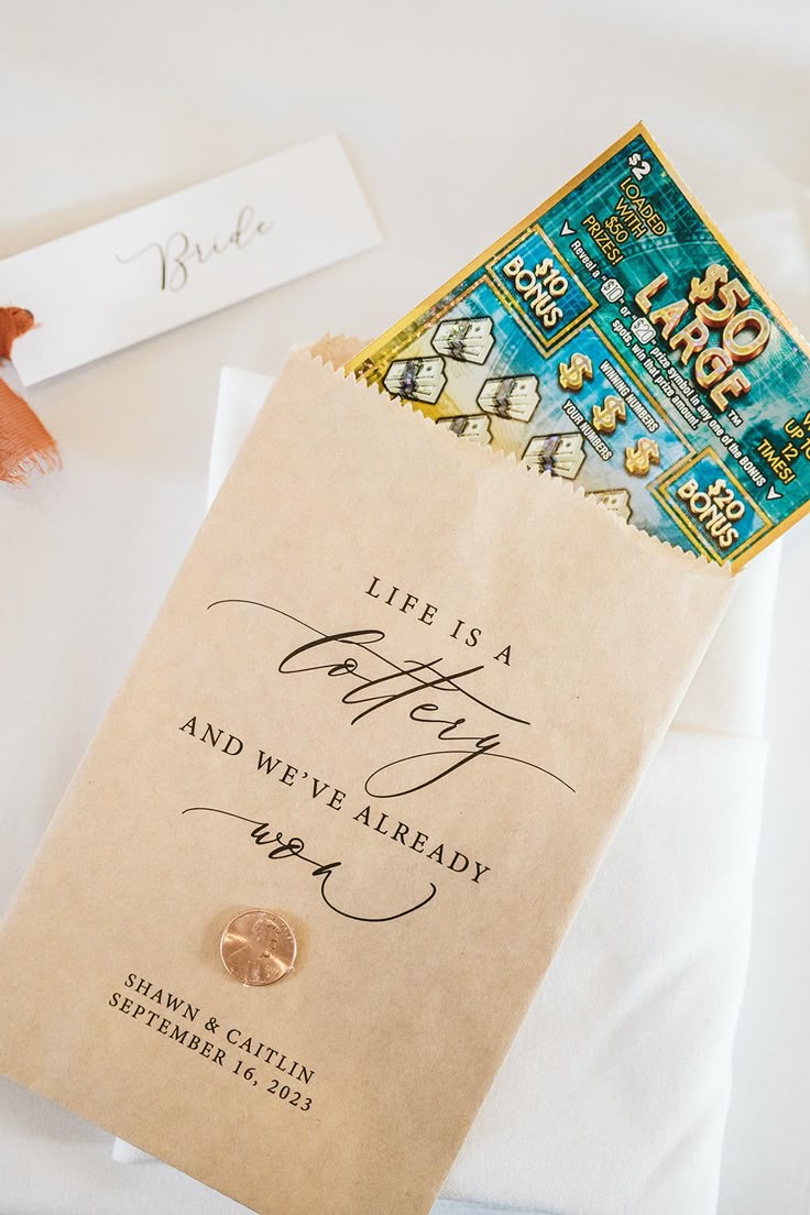 Lottery scratch card wedding favor in personalised kraft bag with Life is a Lottery quote