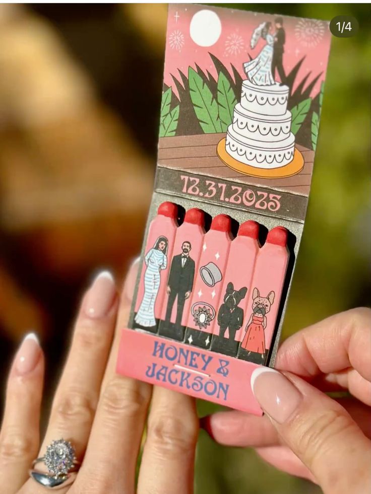 Custom illustrated matchbook wedding favor with couple portraits and wedding date