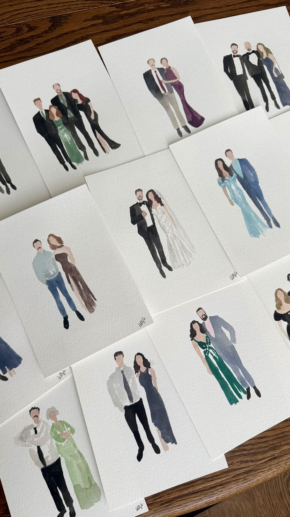 Collection of personalised watercolour guest portraits as wedding favors