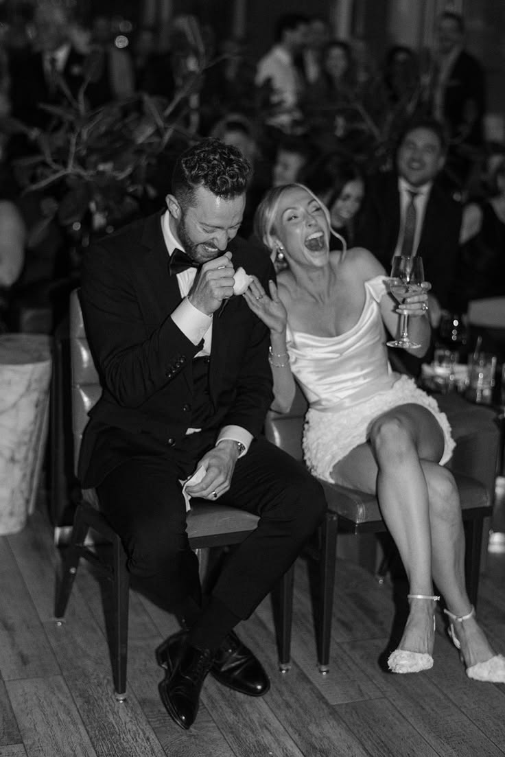 Couple laughing during cheeky mr and mrs questions at wedding