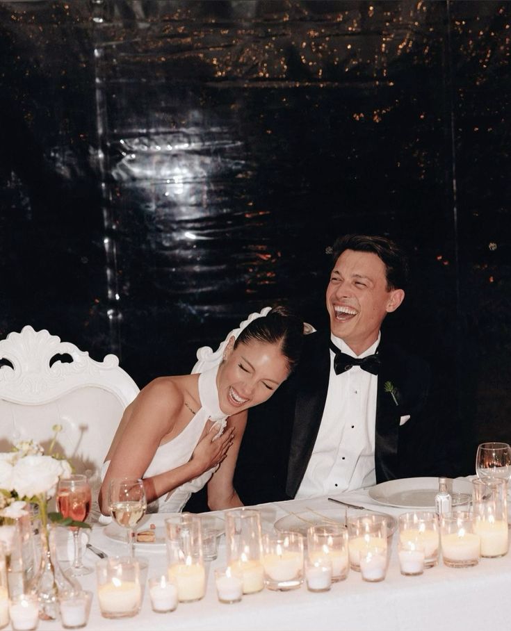 Bride and groom cracking up at spicy mr and mrs quiz answers