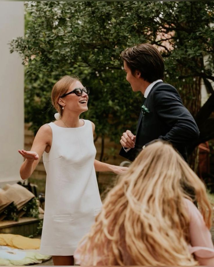 Couple laughing together at funny mr and mrs game moment outdoors