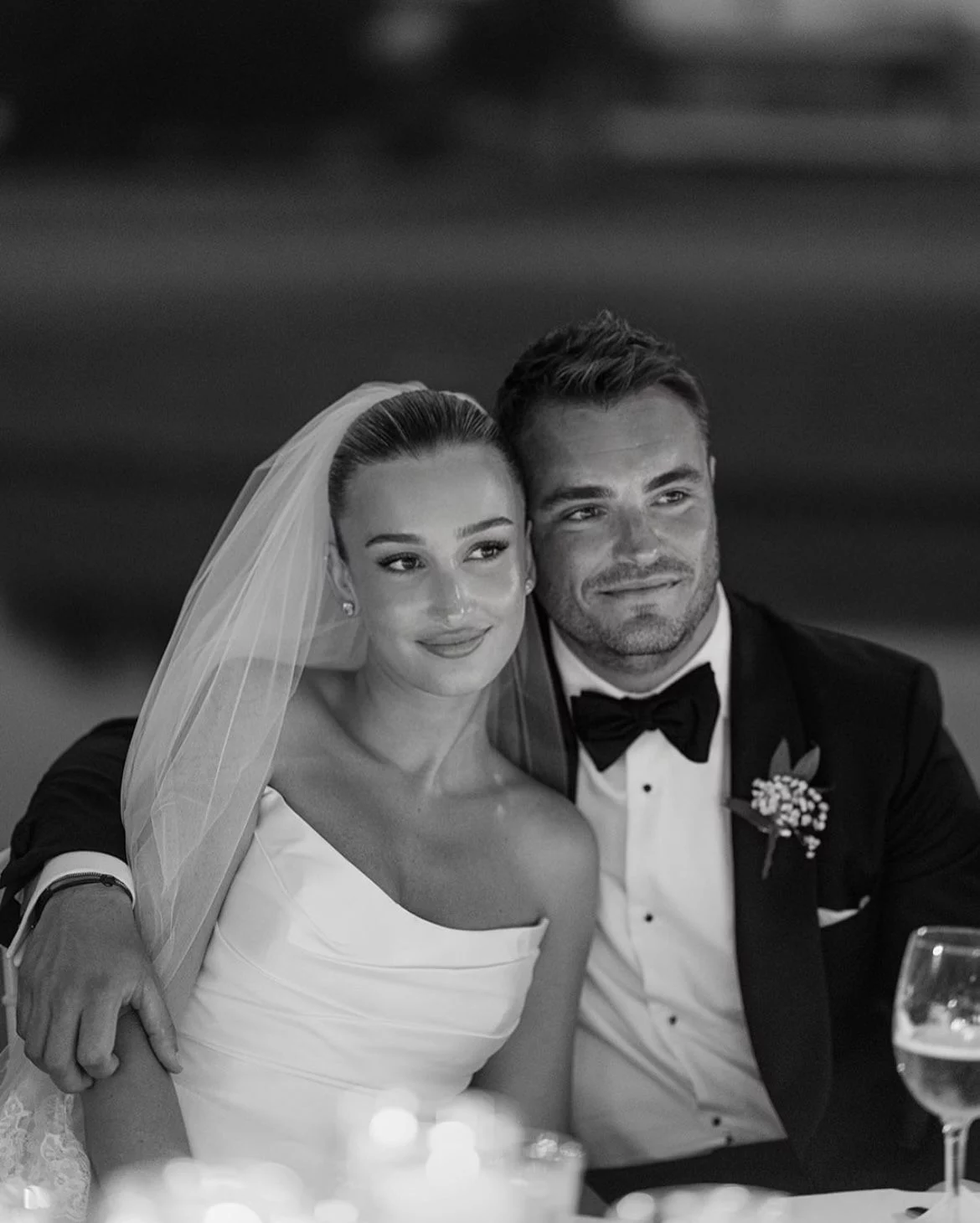 Elegant bride and groom posing together at wedding reception