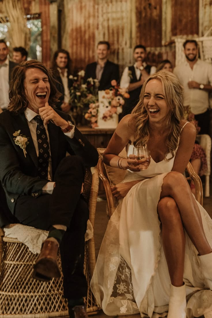 Couple laughing hysterically during mr and mrs game memory test at wedding