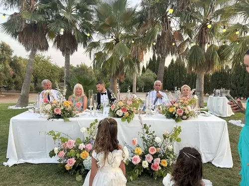 Wedding reception table with floral centerpieces